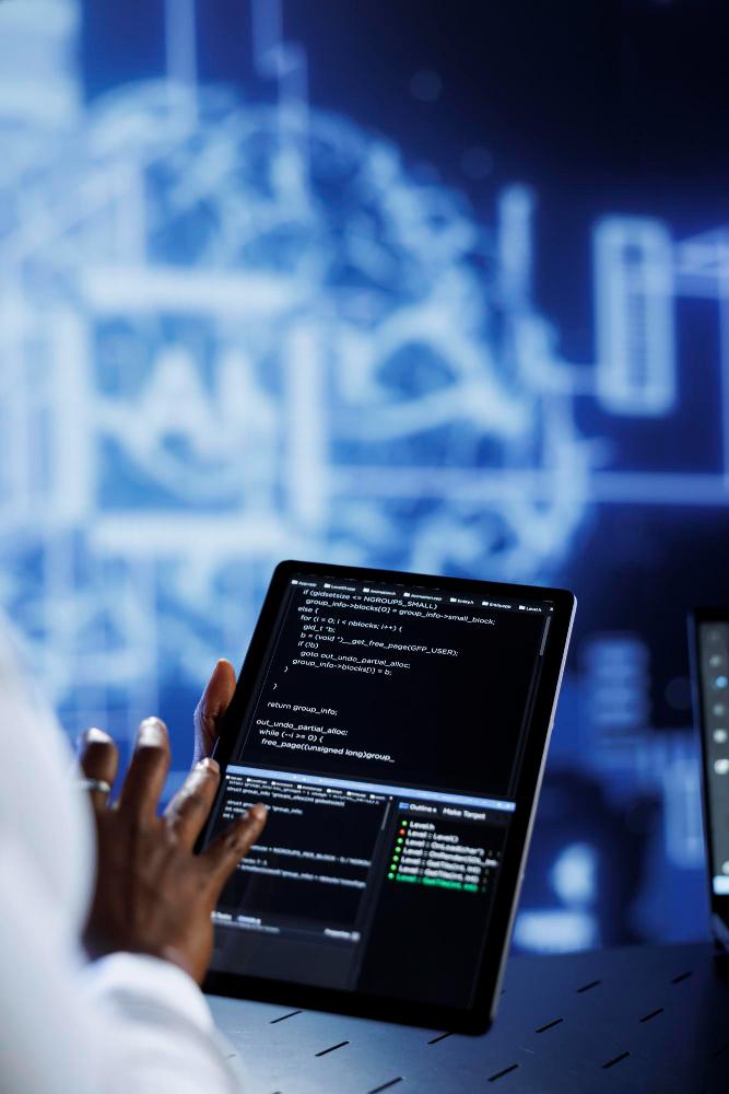 Developer working with code on a tablet for Promethean technology services